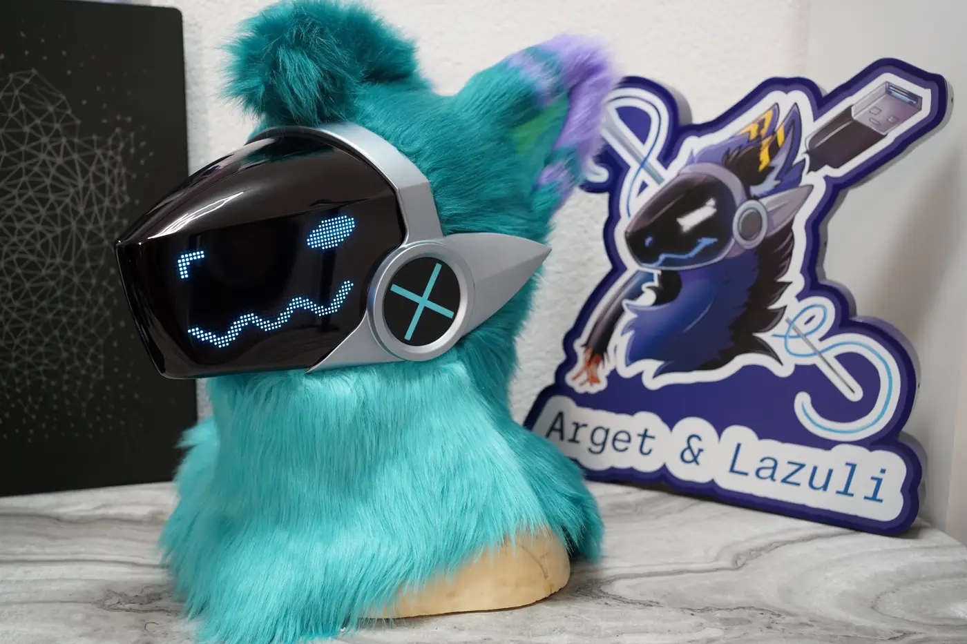 Turquoise Protogen head with purple ear tufts above the silver framed LED visor