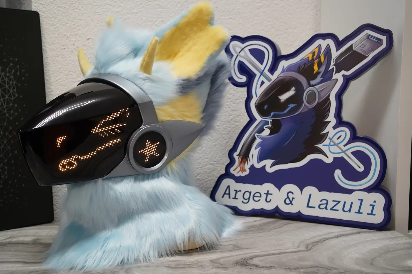 Light blue Protogen head with narrowed yellow pixel eyes on the black LED visor