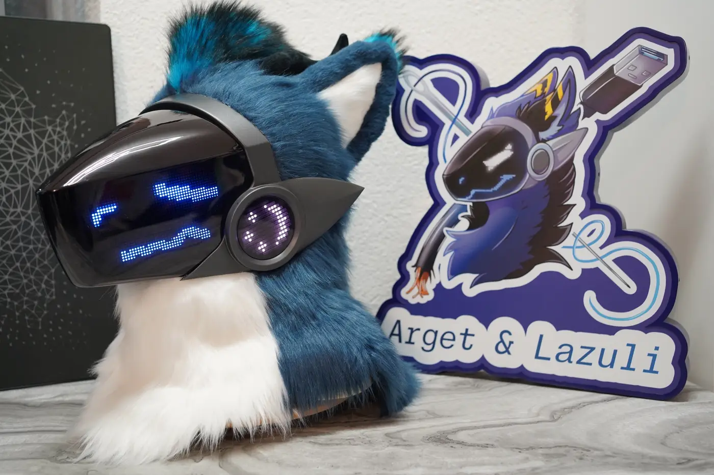 Blue and white Protogen head with a wide blue grin on the black LED visor
