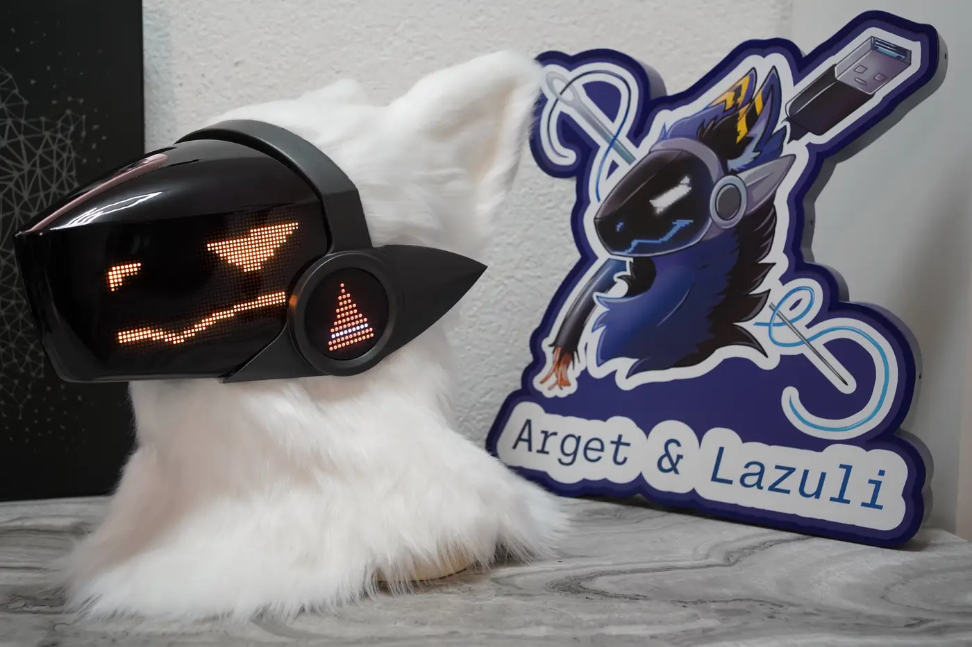 White Protogen head with a wide orange grin on the black LED visor
