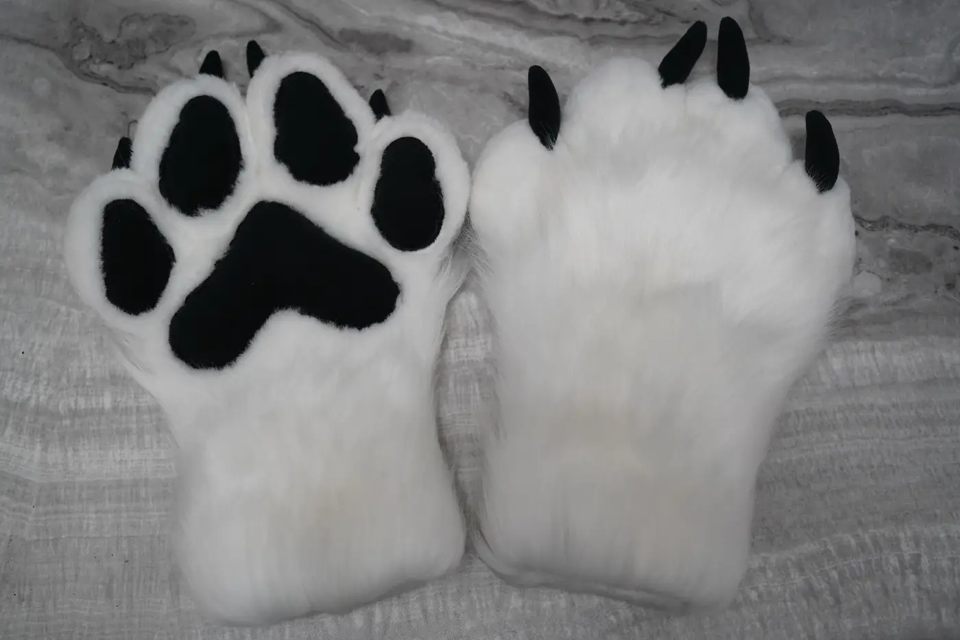 White four finger puffy Protogen hand paws with black paw pads and black claws