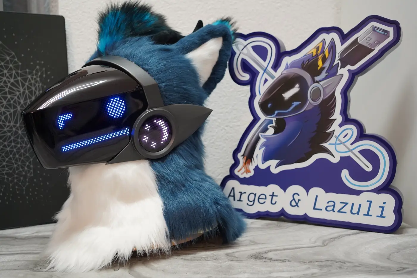 Blue and white Protogen head with straight blue eyes and a flat mouth on the LED visor