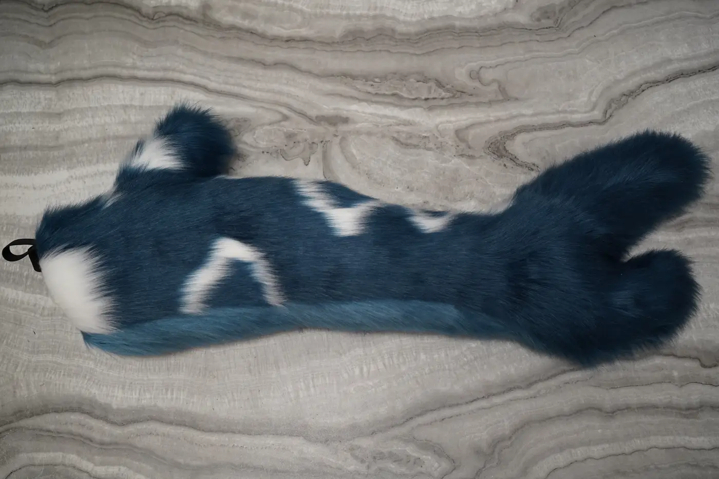 Dark teal shark tail with white markings, hand sewn for the Protogen partial