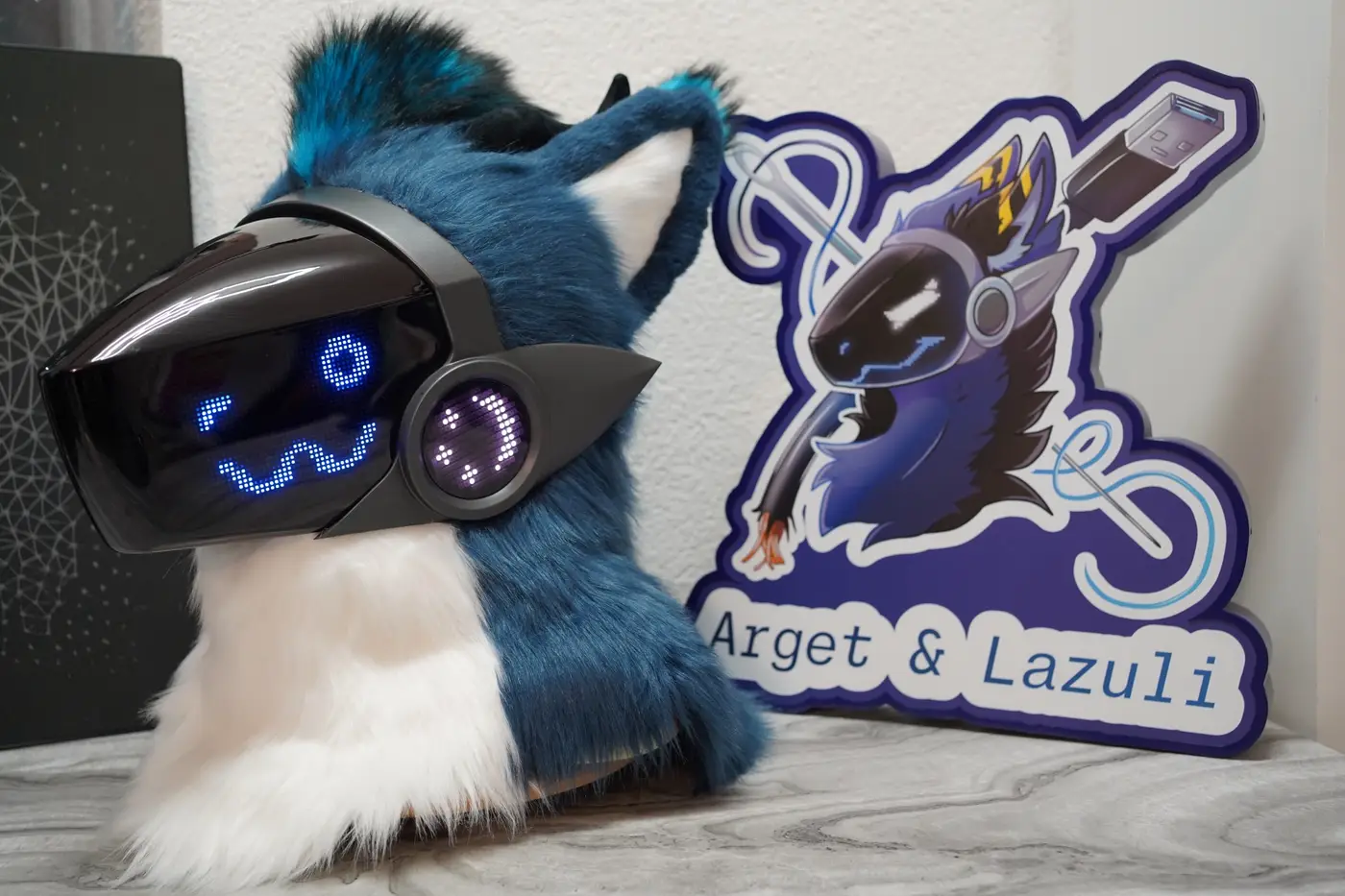 Blue and white Protogen head with wide blue eyes on the black LED visor