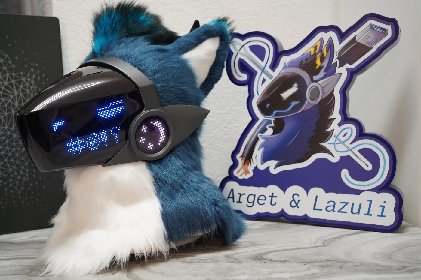 Blue Protogen head with blue symbols across the LED visor